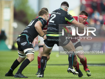 CJ Stander of Munster tackled by Scott Baldwin and Olly Cracknell of Ospreys during the Guinness PRO12 Semi-Final match between Munster Rugb...