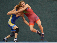 Alyona Kolesnik of Azerbaijan competes against Aisuluu Tynybekova of Kyrgyzstan in the Women's Freestyle 63kg Wrestling final during Baku 20...