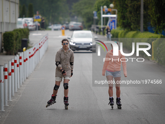 Young woman are seen rollerblading near the Zawisza football stadium in Bydgoszcz, Poland on 20 May, 2017. (