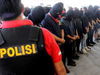 Indonesia  Police  showing evidence of Atlantis Jaya Company held a gay prostitution of 'The Wild One' and 141 people suspected of gay prost...
