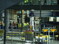 Emergency first responders work on Manchester Victoria railway station, outside the Manchester Arena, after an explosion after the Ariana Gr...