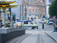 Police officers guard the cordoned off area, outside the Manchester Arena, in Manchester, United Kingdom on Tuesday, May 23rd, 2017. Greater...