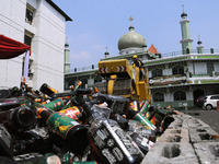 Thousands of alcoholic beverages from unlicensed sellers are destroyed at Polda Metro Jaya, May 23, 2017. Indonesian police conduct the dest...