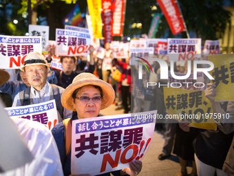 Protesters shout slogans denouncing a pending anti-conspiracy bill during a rally in front of the National Diet building in Tokyo May 23, 20...