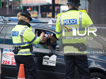 A person offers police officers some food, outside the Manchester Arena, in Manchester, United Kingdom on Tuesday, May 23rd, 2017. Greater M...
