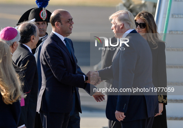 US President Donald Trump and Angelino Alfano,  shake hands at the Airport Fiumicino in  Rome on may 23, 2017 