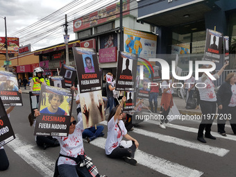 Venezuelans protest outside the building of the United Nations (UN) in Ecuador prior against the regime of Venezuelan President Nicolas Madu...