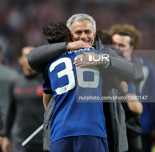 Jose Mourinho, Manager of Manchester United celebrates with Matteo Darmian of Manchester United following victory in the UEFA Europa League...