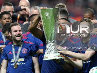 Manchester United's team celebrate with the trophy after they won the UEFA Europa League Final match between Ajax and Manchester United at F...