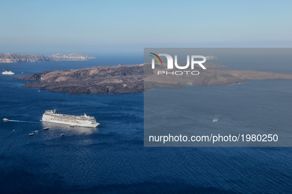 Cruise ship in the Aegean Sea by the Caldera near Santorini Island, Greece. 