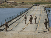 The Iraqi Army has established a bridge across the Tigris in Northern Mosul to allow civilians to escape the fighting in West Mosul and ease...