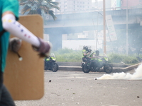 Opposition demonstrators clash with the police during a protest in Caracas, on May 24, 2017. Venezuela's President Nicolas Maduro formally l...