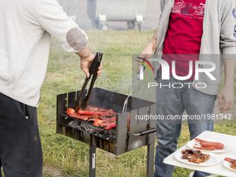 People grill on Father's or Men's day at the Tempelhofer Feld park in Berlin, Germany on May 25, 2017. (