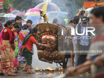 Nepalese people offering ritual prayer during celebration of Bhoto Jatra festival at Jawalakhel, Patan, Nepal on Thursday, May 25, 2017. Rat...