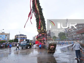 Workers cleans around the Rato Macchendranath Chariot as for the celebration of Bhoto Jatra festival at Jawalakhel, Patan, Nepal on Thursday...