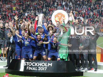 Wayne Rooney of Manchester United lifts the trophy following the UEFA Europa League Final match between Ajax and Manchester United at Friend...