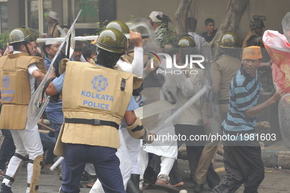 Indian Police lathi charge on the BJP workers during a protest march from Howrah, College Square and Esplanade towards Lalbazar, Kolkata Pol...