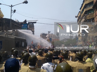 Indian Police using water canon on the BJP workers  during a protest march from Howrah, College Square and Esplanade towards Lalbazar, Kolka...