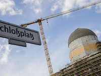The road sign Schlossplatz (Castle square) and the dome of the reconstruction of the Hohenzhollern city palace / Humboldt Forum are pictured...