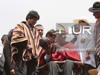 President of Ecuador, Lenin Moreno receives the ceremonial staff of indigenous leaders in the archaeological park of Cochasquí, an area cons...
