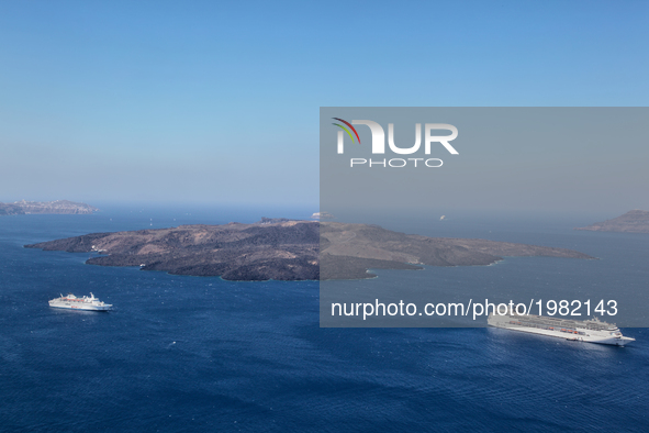 Cruise ships in the Aegean Sea by the Caldera near Santorini Island, Greece. 
