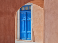 Doorway to a pink building in the village of Oia (Ia) on Santorini Island, Greece.  (