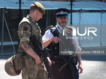  Armed Police Officers and British Army soldiers are seen in Central London on May 26, 2017. Police surveillance was integrated with the sen...