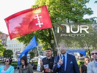 Pawel Adamowicz - mayor of Gdansk and protesters with slogans demanding education reform referendum are seen in Gdansk, Poland on 26 May 201...
