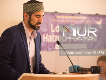 Galib Khan recites a passage from The Holy Quran during a prayer service at the Darul Aman Mosque, for the victims of the Manchester Arena e...