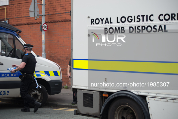 A United Kingdom Armed Forces bomb disposal unit and a police van at the location of the investigation in to the Manchester Arena explosion...