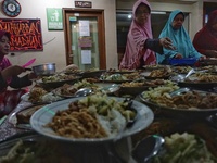 Indonesian Muslims prepare foods for breaking their fast at the Jogokariyan Mosque, Yogyakarta, Indonesia on June 25, 2016. The Islamic holy...