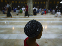 A boy while people prepare to break the fast on the first day of Ramadan in a Mosque in Bangkok, Thailand May 27, 2017. (