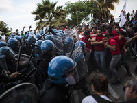 Leftist demonstrators march to protest the G7 summit at nearby Taormina on the island of Sicily on May 27, 2017 in Giardini Naxos, Italy. T...