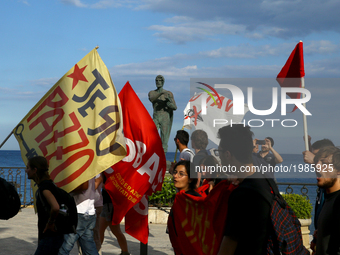 Demonstrators against G7 near the statue of Theocles along the boardwalk of Taormina, Italy on May 27, 2017.
(
