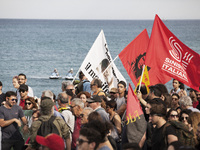Italy, Taormina: Demonstrators wave flags during the 'No G7' protest march at the G7 summit in Giardini Naxos, near Taormina, Sicily island,...