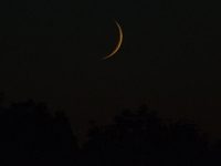The waxing crescent, the last phase before the new moon is seen on the horizon of the city of Bydgoszcz, Poland on 27 May, 2017. (