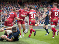Rob Evans, DTH van der Merwe and Jonathan Evans of Scarlets celebrate after scoring during the Guinness PRO12 Final between Munster Rugby an...