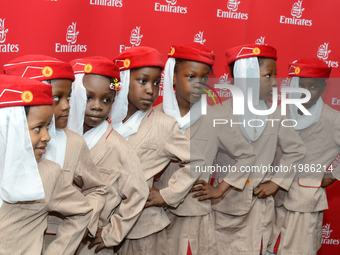 Selected school children in cabin crew uniform pose during the Emirates Airline organised Children’s Day in Lagos, Nigeria May 27 2017. (