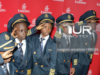 Selected school children in pilot uniform pose during the Emirates Airline organised Children’s Day in Lagos, Nigeria on Saturday May 27 201...