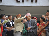 Election commissioner congratulate the winner of new mayor of the Kathmandu Metropolitan City on Sunday, May 28, 2017. Bidya Sundar Shakya o...