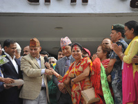 Election commissioner congratulate the winner of new deputy mayor of the Kathmandu Metropolitan City on Sunday, May 28, 2017. Bidya Sundar S...