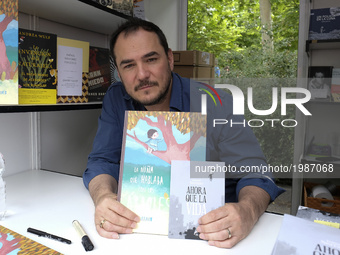 Ismael Serrano signs books during the book fair in Madrid held from May 26 to July 11, 2017 in Retiro Park in Madrid. Spain. May 28, 2017 (