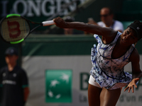 US Venus Williams serves to China's Wang Qiang during their tennis match at the Roland Garros 2017 French Open on May 28, 2017 in Paris.  (