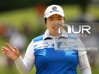 Shanshan Feng of China acknowledge the gallery on the 18th green during the final round of the Volvik Championship held at Travis Pointe Cou...