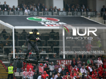 A man flies over the pitch with the game ball before the Portugal Cup Final football match  SL Benfica vs Vitoria Guimaraes SC at Jamor stad...