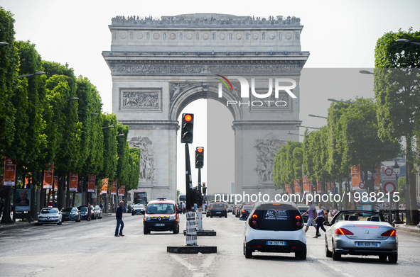 View Of Paris Triumphal arch in Paris, France on May 28, 2017. Much of French people and tourists enjoyed hot and sunny weather with tempera...