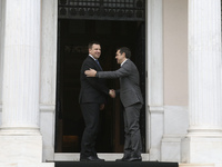PM Alexis Tsipras (R) wellcomes his Estonian counterpart Juri Ratas, in Athens on May 29, 2017 (