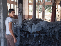 A Palestinian boy looks at what remains of the Al Ameen Mohammed Mosque, in the center Gaza, after being bombed by the Israeli forces. (