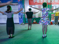 A group of women enjoys a Square Dancing in Huangshi center.
On Monday, September 19, 2016 in Huangshi, Yangxin County, China. (
