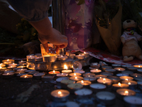 Candles, as a tribute for the victims of the Manchester Arena attack, in Manchester, United Kingdom, Monday, May 29, 2017. Greater Mancheste...